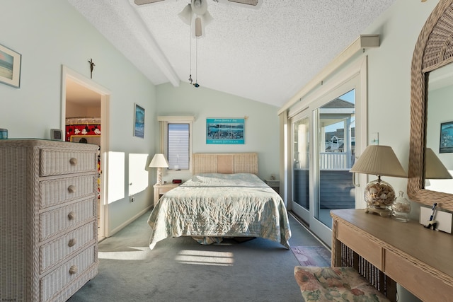 bedroom with multiple windows, ceiling fan, lofted ceiling with beams, and access to exterior