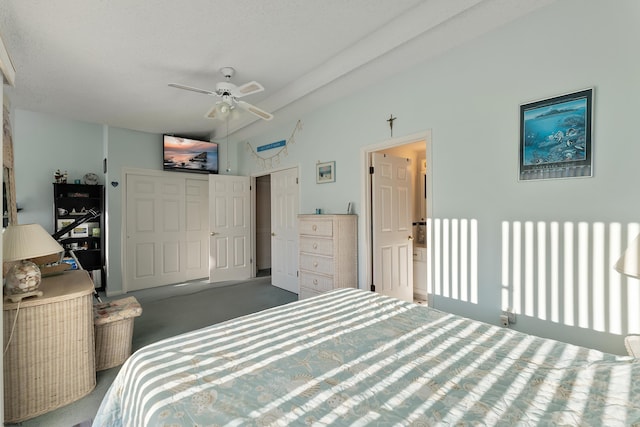 bedroom with carpet, a textured ceiling, a closet, and ceiling fan