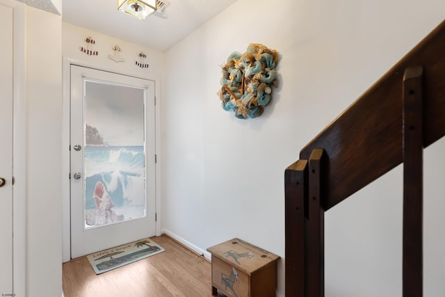 doorway to outside featuring light wood-type flooring