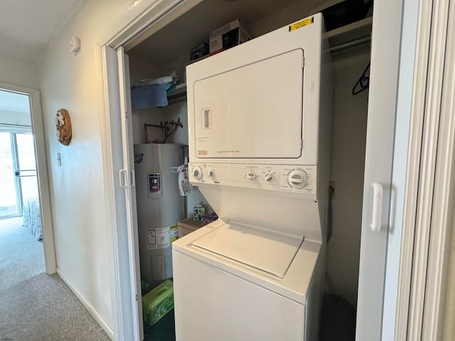 washroom featuring stacked washer and dryer, electric water heater, and carpet flooring