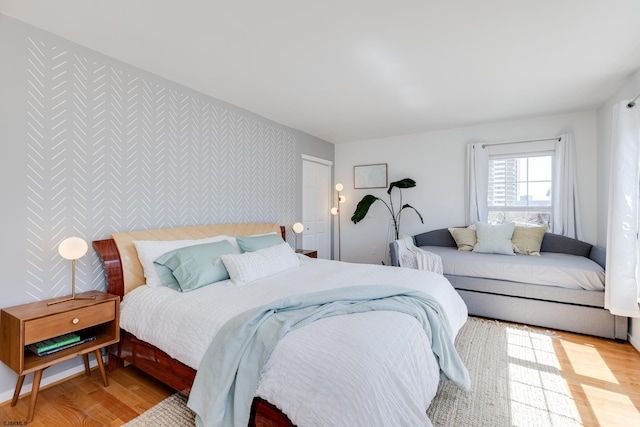 bedroom with light hardwood / wood-style flooring