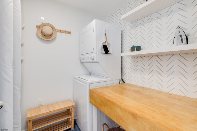 laundry area with stacked washer and dryer