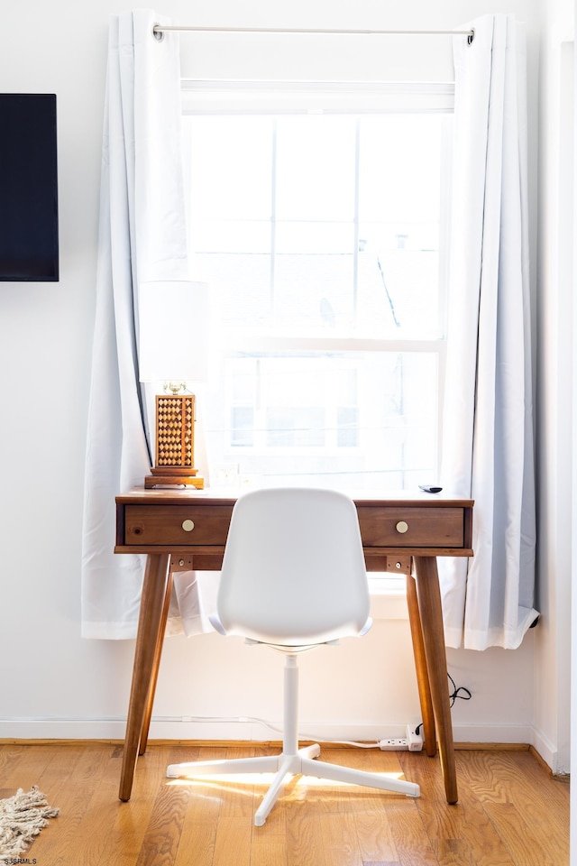 home office featuring light hardwood / wood-style floors