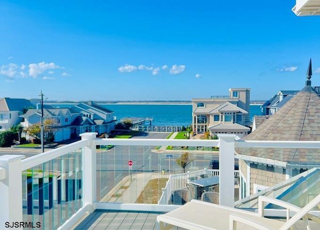 balcony featuring a water view