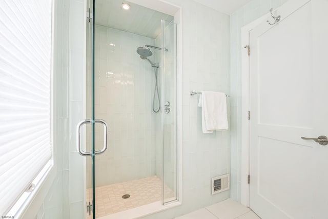 bathroom featuring tile patterned flooring and walk in shower