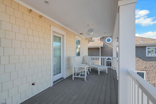 wooden deck with ceiling fan