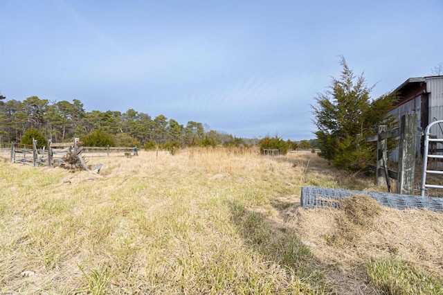 view of yard with a rural view