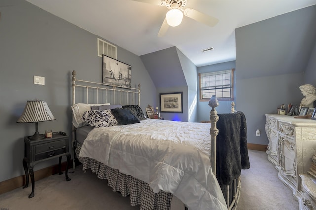 bedroom with ceiling fan, light colored carpet, and lofted ceiling