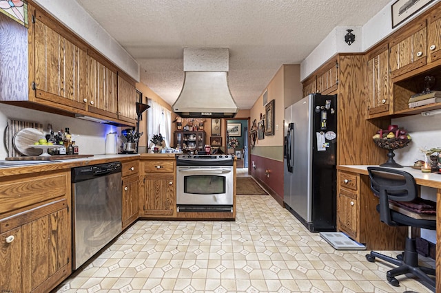 kitchen featuring appliances with stainless steel finishes and a textured ceiling