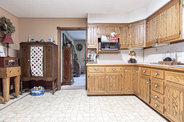 kitchen featuring a textured ceiling