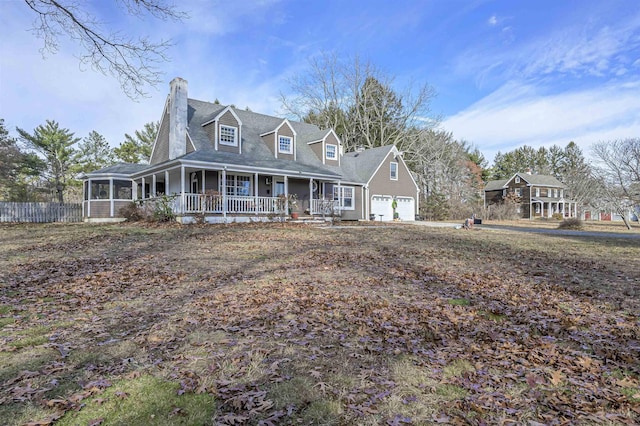 view of front of home featuring a porch and a garage