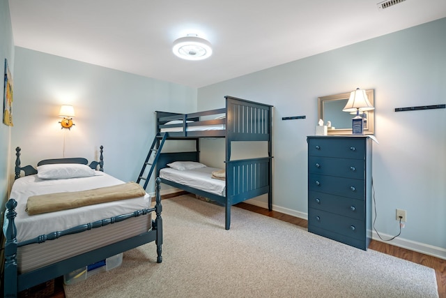 bedroom with wood-type flooring