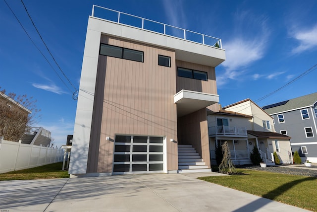 contemporary house with a balcony and a garage