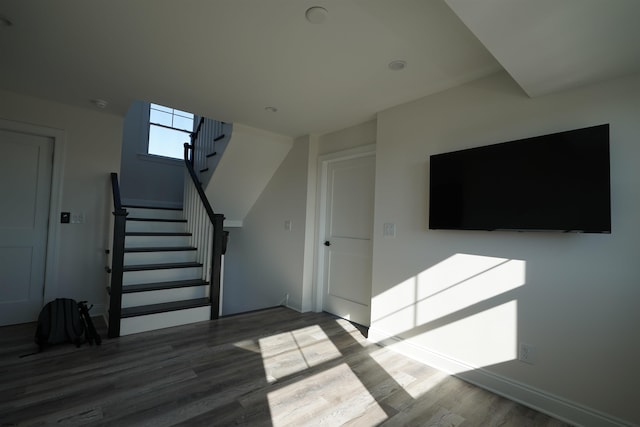 stairs featuring hardwood / wood-style flooring