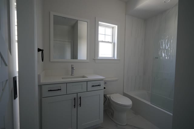 full bathroom featuring washtub / shower combination, toilet, and vanity