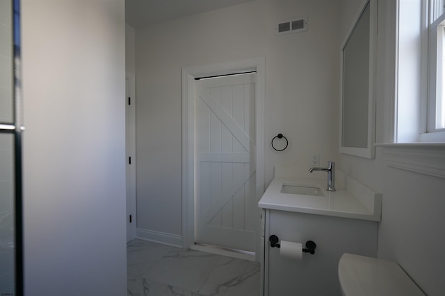 bathroom with toilet and vanity