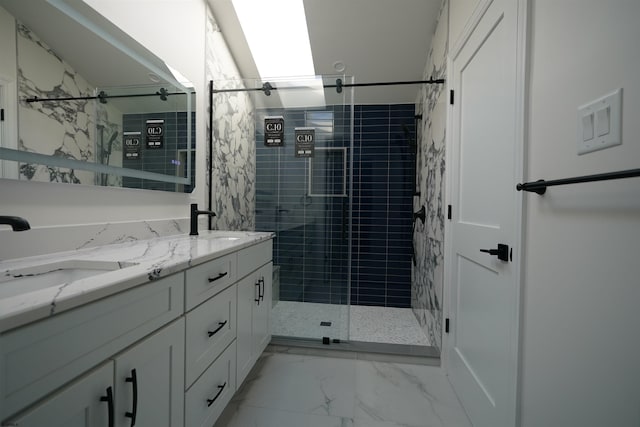 bathroom with walk in shower and vanity