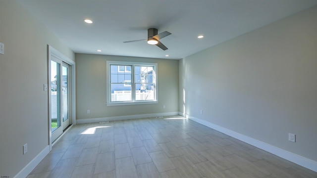 unfurnished room with light wood-type flooring and ceiling fan