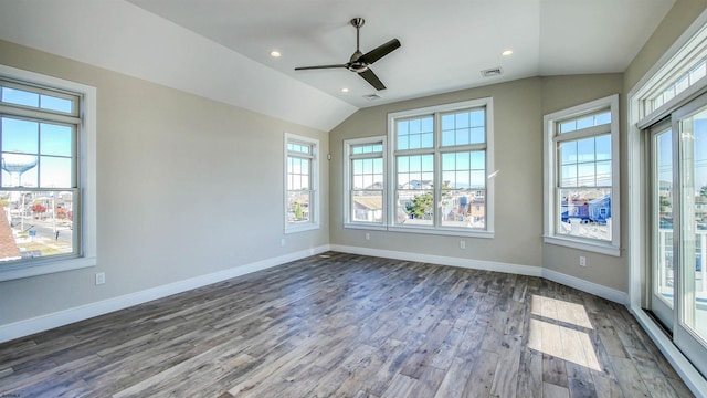 empty room featuring ceiling fan, wood-type flooring, and vaulted ceiling