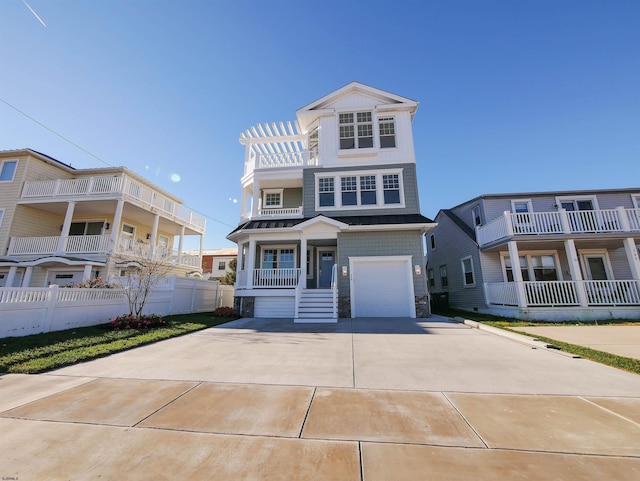 view of front of property with a porch and a garage