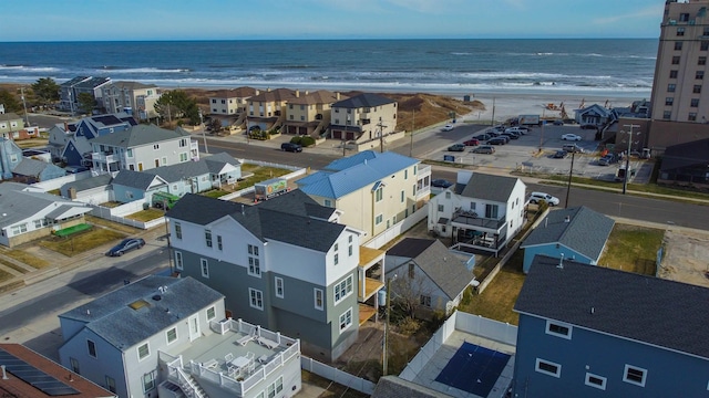 bird's eye view featuring a water view and a view of the beach