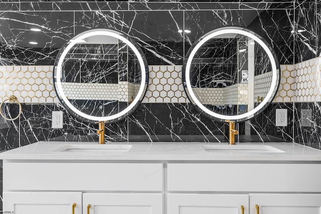 bathroom with tasteful backsplash and vanity