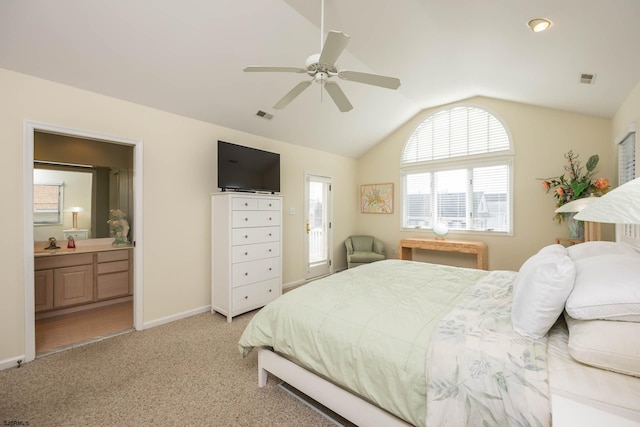 carpeted bedroom featuring ensuite bath, ceiling fan, and lofted ceiling