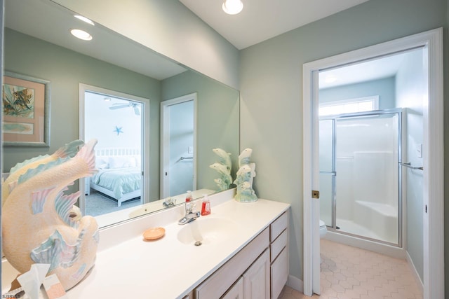 bathroom with tile patterned floors, vanity, and a shower with shower door