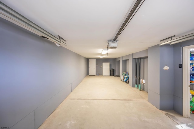 basement with white refrigerator