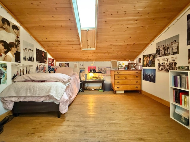 bedroom featuring wooden ceiling, light hardwood / wood-style flooring, and vaulted ceiling