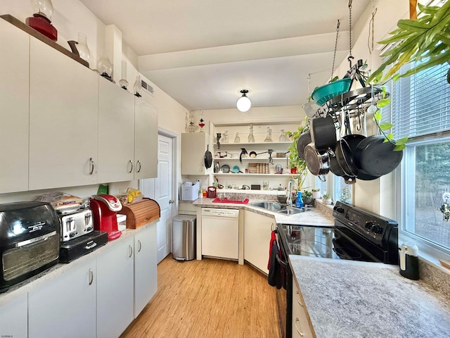 kitchen featuring white cabinets, dishwasher, light wood-type flooring, and black electric range