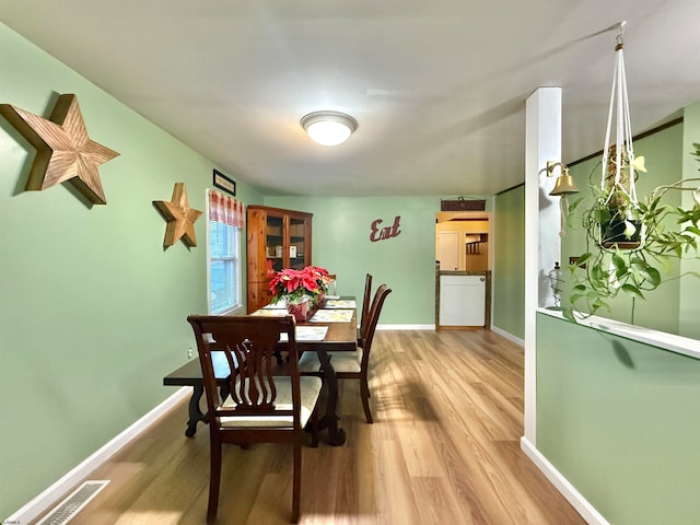 dining space featuring hardwood / wood-style floors