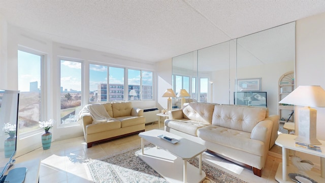 tiled living room featuring a textured ceiling