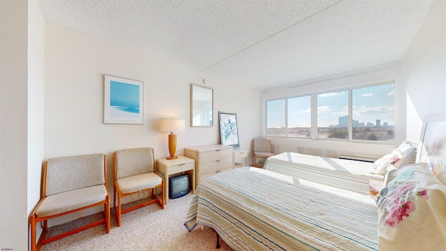 carpeted bedroom featuring a textured ceiling