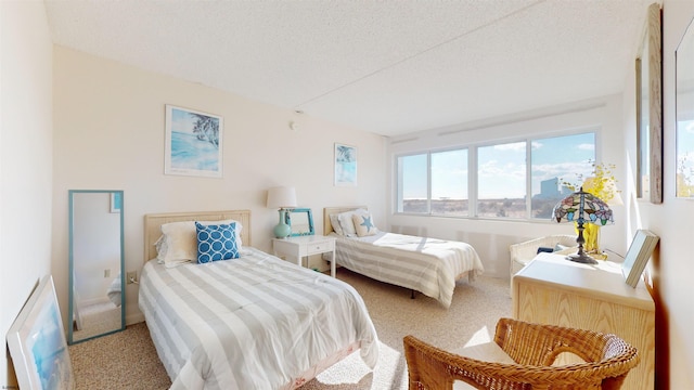 carpeted bedroom featuring a textured ceiling