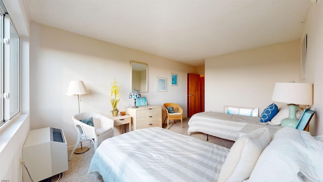 bedroom featuring light colored carpet