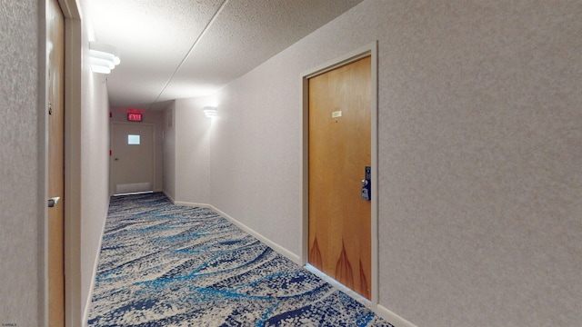 hallway featuring carpet flooring