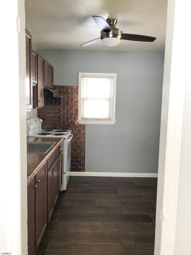 kitchen with ceiling fan, tasteful backsplash, dark brown cabinets, white electric range, and dark wood-type flooring