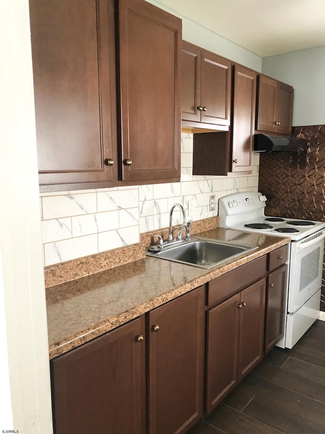 kitchen featuring light stone countertops, sink, tasteful backsplash, white electric range, and dark brown cabinetry