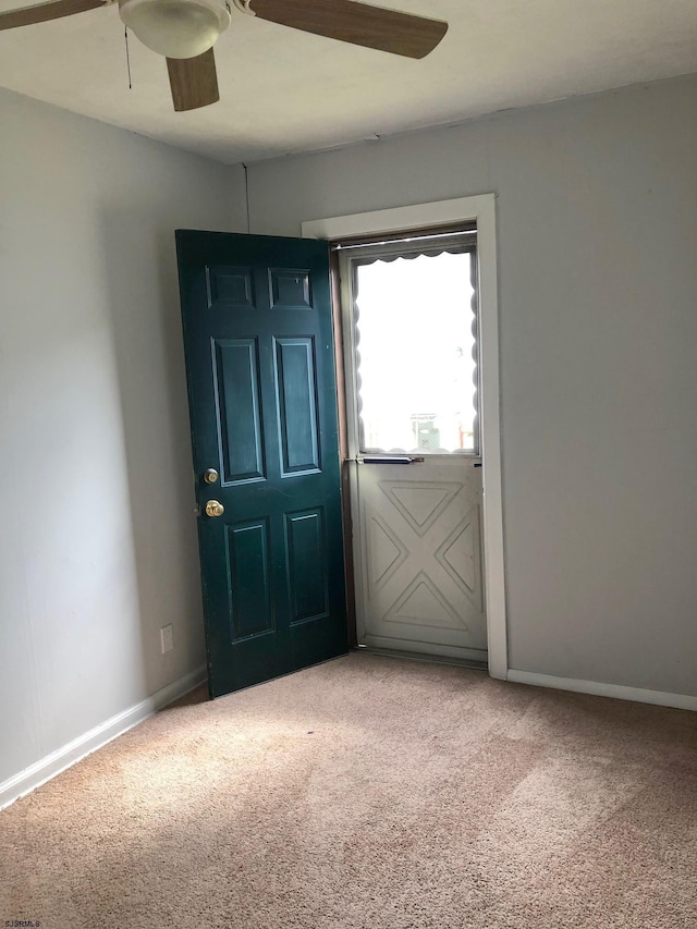 view of carpeted foyer