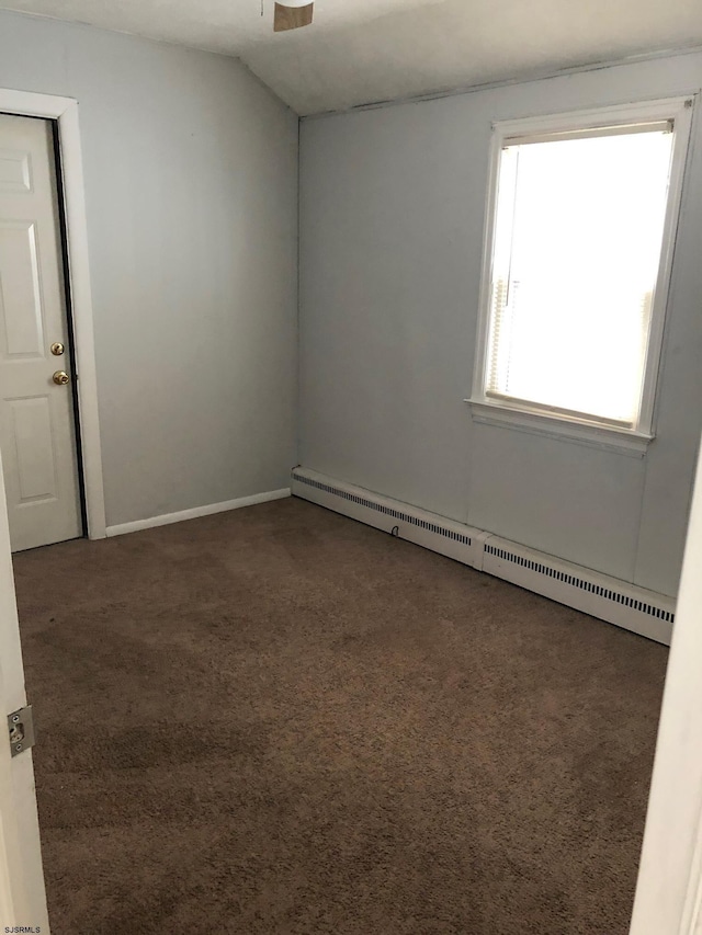 carpeted empty room with baseboard heating