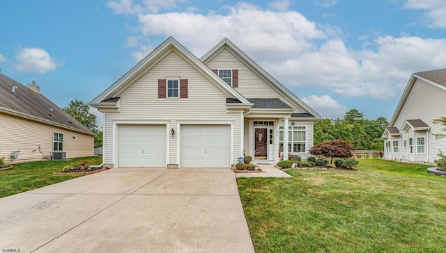 view of front of house with a garage and a front lawn