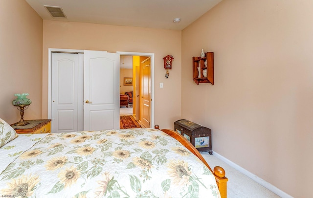 carpeted bedroom featuring a closet