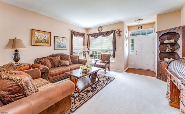 living room featuring light carpet