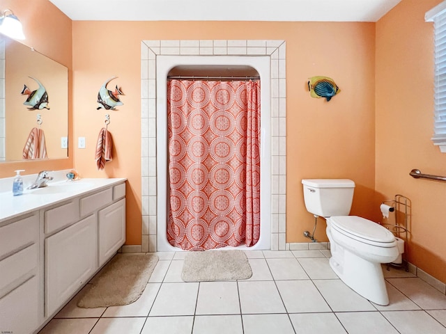 bathroom with tile patterned flooring, vanity, a shower with shower curtain, and toilet