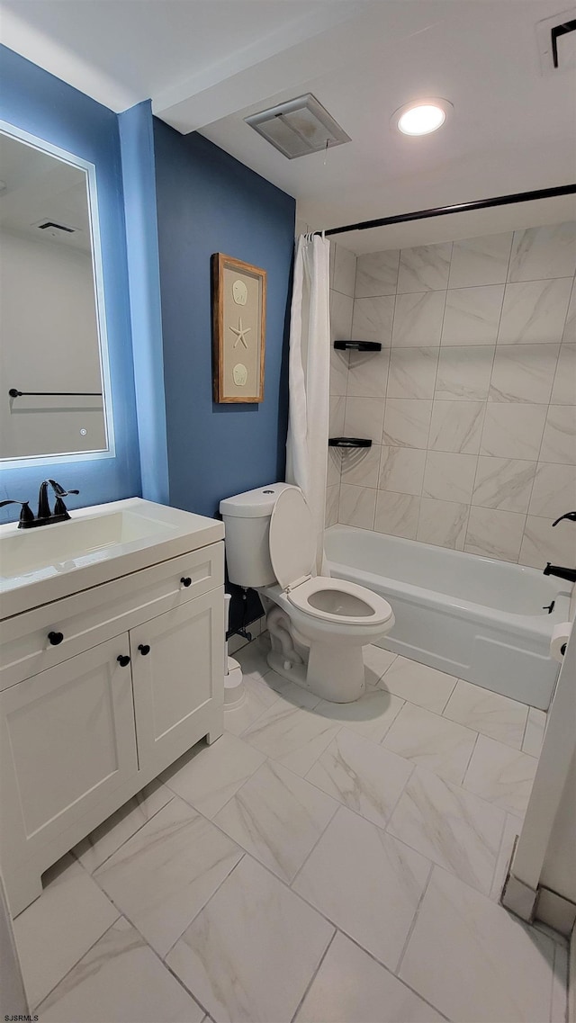 full bathroom with toilet, vanity, and shower / tub combo with curtain