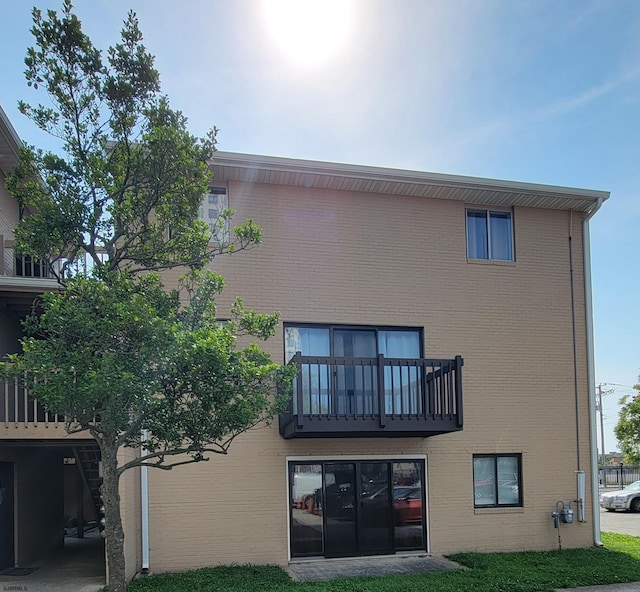 back of property featuring a balcony