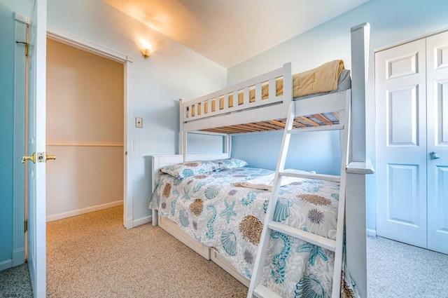 carpeted bedroom with a closet