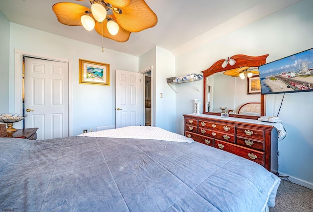 carpeted bedroom featuring ceiling fan and a closet