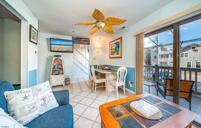 dining room with ceiling fan and light tile patterned flooring